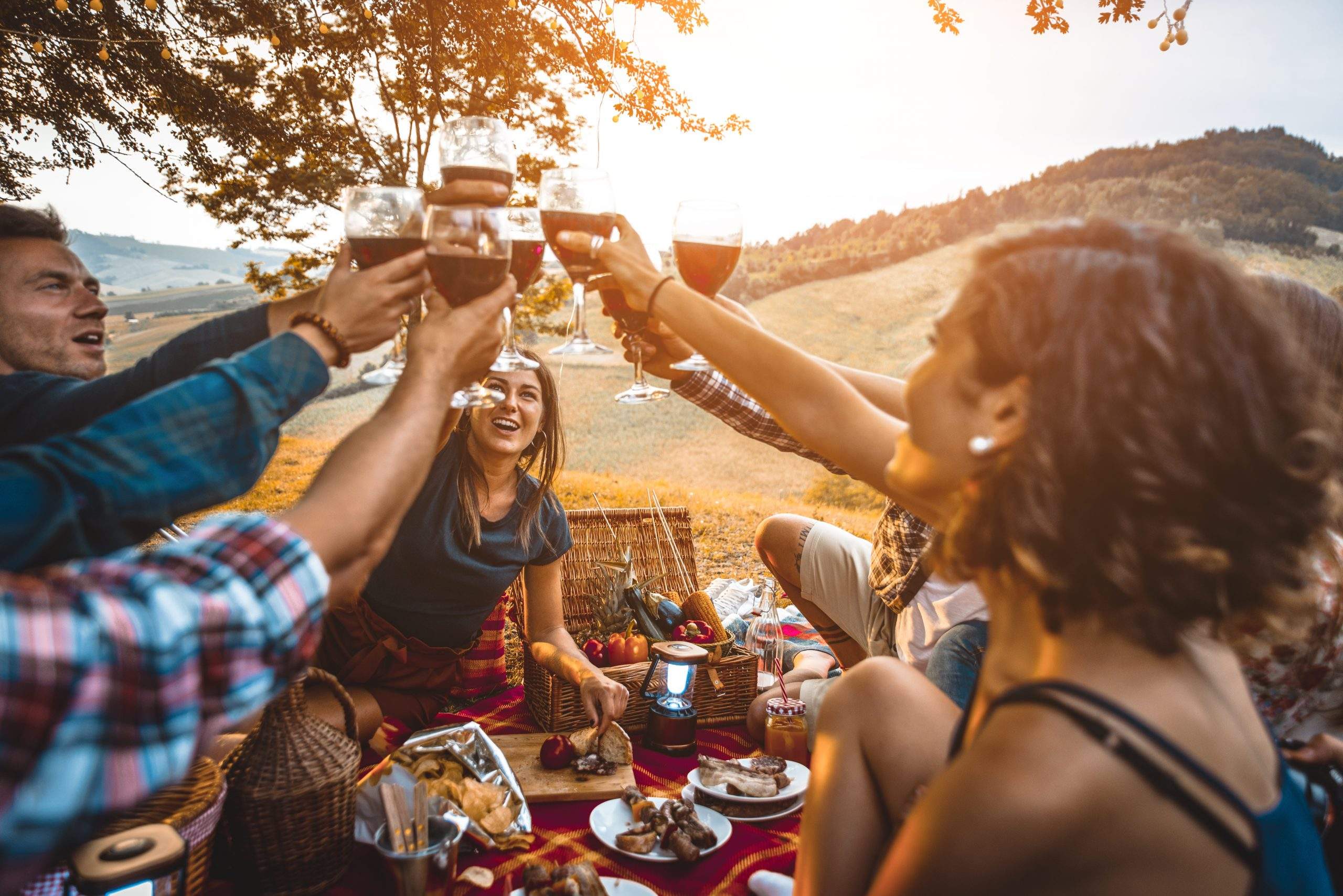 Group of friends eating in the nature